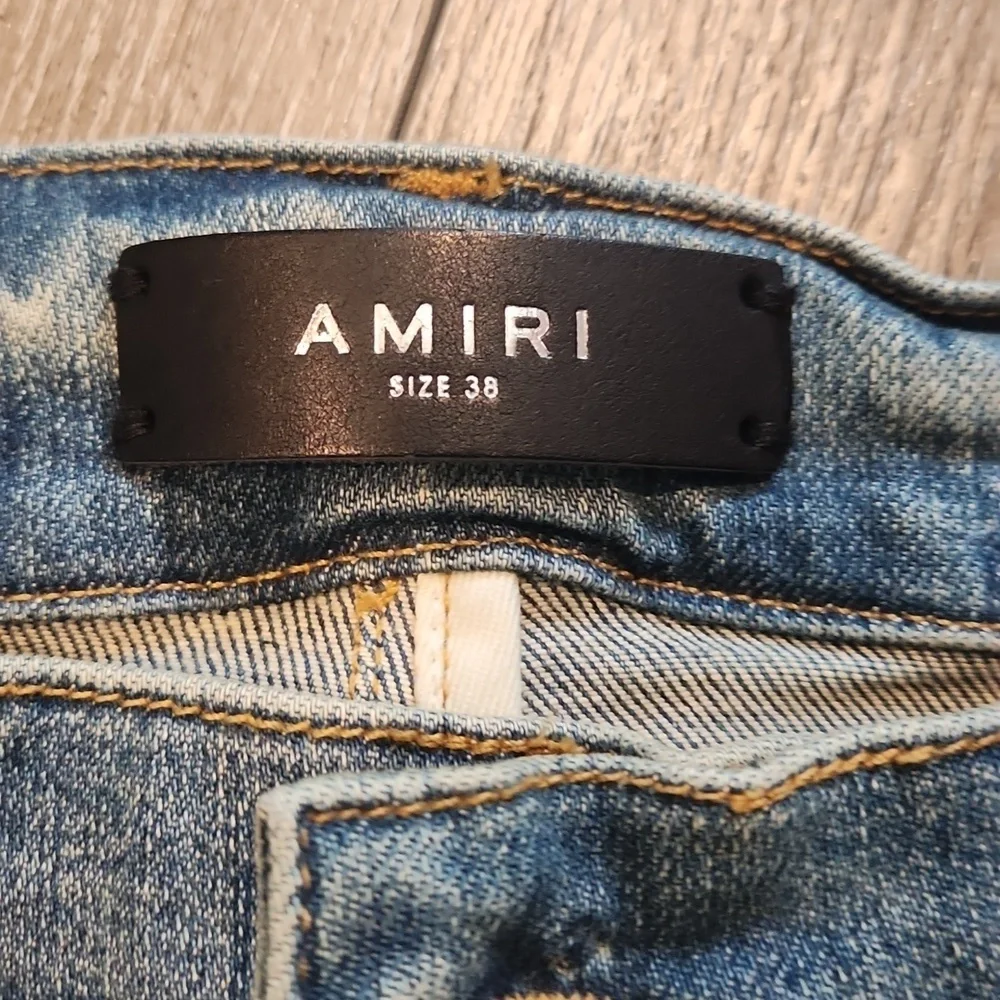 AMIRI Blue and White Skinny Jeans with Distressed Details